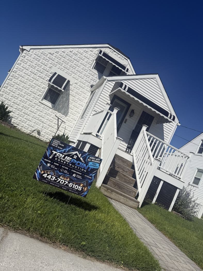 Home with roofing and exterior work